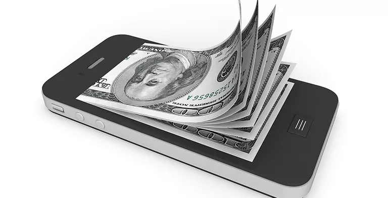 bigstock-Money-In-Mobile-Phone-39858736